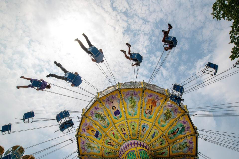 Amusement park attendees ride a swing at Adventureland in Farmingdale, New York (Photo by Alejandra ... [+]